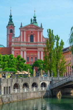 Franciscan Church of the Annunciation ant the riverside of Ljubljanica river in Ljubljana, Slovenia clipart