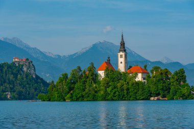 Assumption of Maria church and Bled Castle at lake Bled in Slovenia clipart