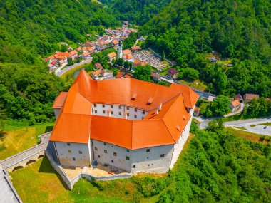 Rajhenburg castle overlooking Brestanica village and Sava river in Slovenia clipart