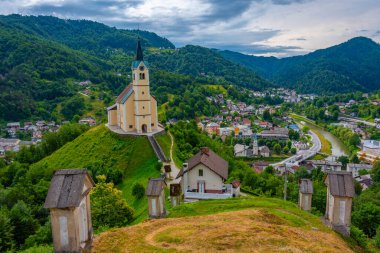 Church of Saint Anthony and panorama of Slovenian town Idrija clipart