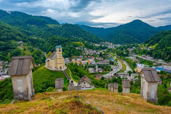 Church of Saint Anthony and panorama of Slovenian town Idrija