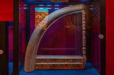 Baku, Azerbaijan, September 16, 2023: Cheng musical instrument at the Palace of the Shirvanshahs in Baku, Azerbaijan clipart