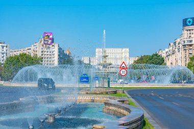 Bucharest, Romania, August 21, 2023: Panorama view of a fountain at the Unirii square in Bucharest, Romania clipart