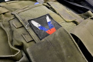 A fragment of a bulletproof vest with a chevron 