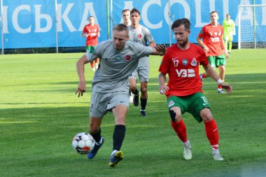 FC Lokomotyv Kyivs Arutiunian Davyd (17), Ukrayna Kupası eleme karşılaşmasında Şkolnyi Kostiantyn (2) Dinaz (Vyshhorod) ile FC Dinaz (Vyshhorod), Kyiv, Ukrayna