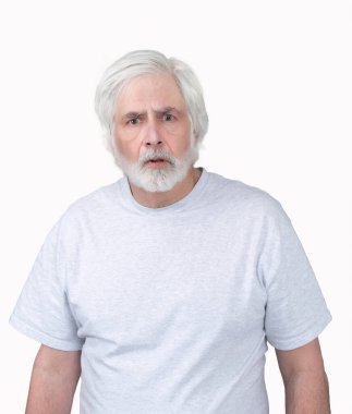 Vertical shot of an old man looking startled or frightened.  Standing from the waist up.  Isolated on white.