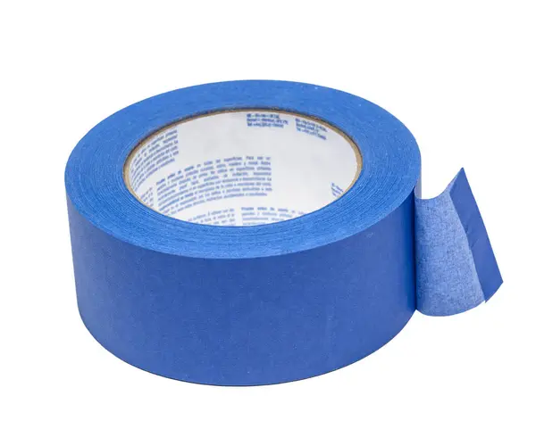 stock image Horizontal close-up shot of a four inch roll of blue painters tape isolated on white.