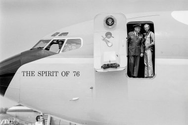 Fort Chaffee, Arkansas, United States - August 10, 1975:  Air Force officer and presidential photographer David Hume Kennerly look out from Air Force One on trip with President Gerald R. Ford. President Ford was in Arkansas to welcome newly-arrived V clipart