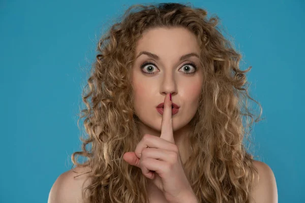 Attractive Blonde Woman Curly Blond Hair Making Silence Gesture Blue — Stock Photo, Image