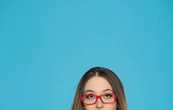 Half Portrait Young Woman Glasses Looking Blue Background — Stock Photo, Image