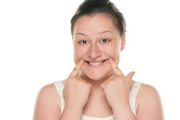Young Chubby Woman Forcing Her Smile Her Fingers White Studio — Stock Photo, Image