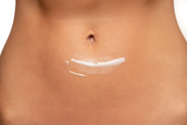 Close Partial View Woman Posing Body Cream Belly White Studio — Foto de Stock