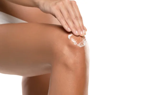 Woman Applying Moisturizer Cream Knee Isolated White Background — Foto de Stock