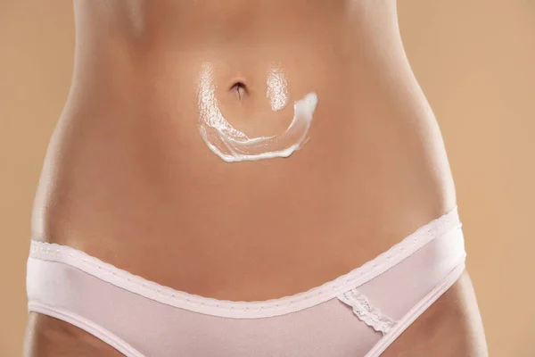Close Partial View Woman Body Cream Belly Beige Studio Background — Foto de Stock