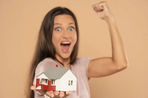 Young Happy Woman Holding House Sample Model Isolated Beige Studio — Stockfoto