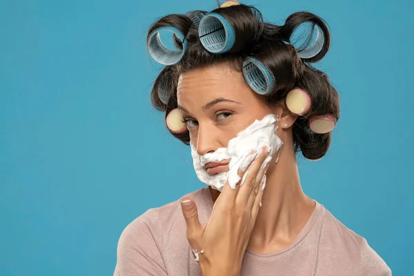 Attractive Young Woman Hair Curlers Rollers Applyes Shaving Foam Her — Stockfoto