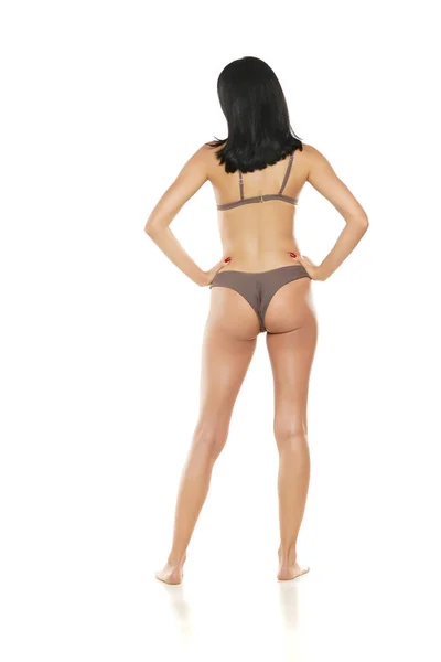 Vista Trasera Una Joven Morena Bikini Posando Sobre Fondo Estudio —  Fotos de Stock
