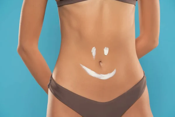 Woman Belly Close Smile Drawn Lotion Blue Studio Background — Stock Photo, Image