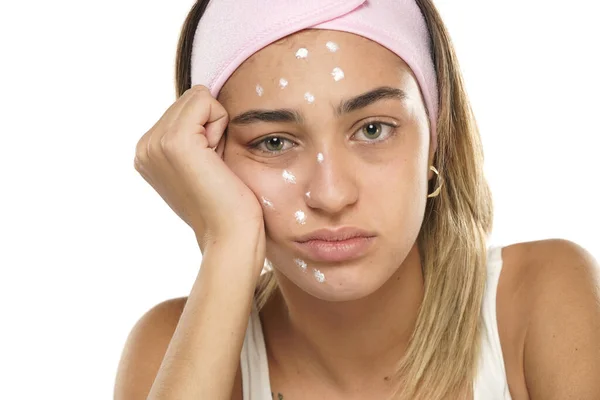 Unhappy Sad Woman Posing Face Cream White Studio Background — Stock Photo, Image