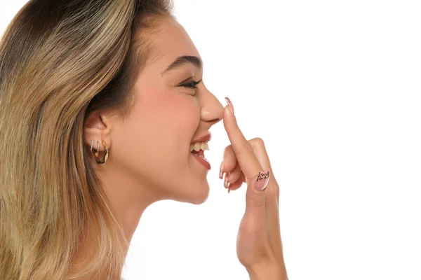 Young Happy Woman Touches Her Nose Her Finger White Studio — Stock Photo, Image