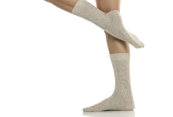 Close Female Legs Gray Wool Winter Socks White Studio Background — Stock Photo, Image