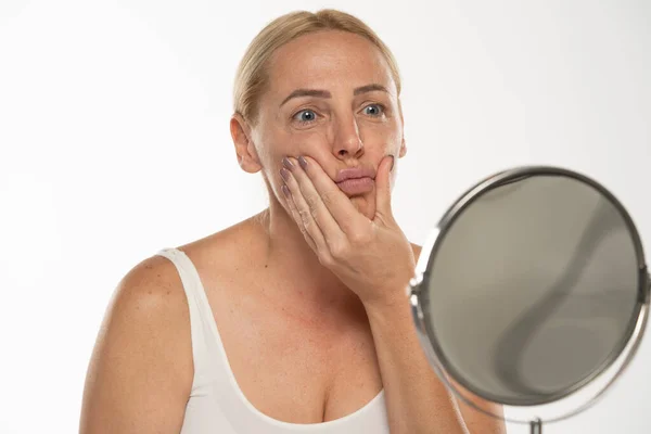Worried Middle Aged Blond Woman Front Mirror Touches Her Mouth — Stock Photo, Image