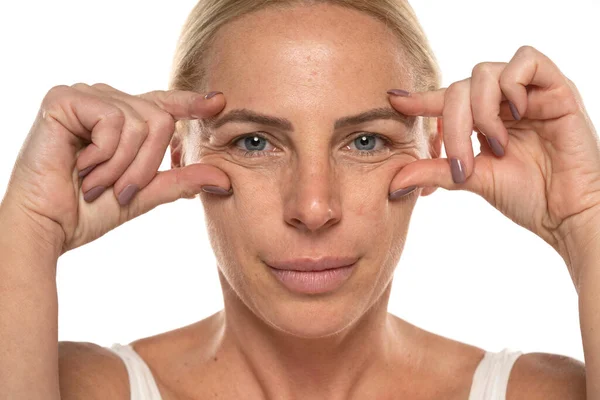 Portrait Senior Woman Make Showing Her Eye Wrinkles White Studio — Stock Photo, Image