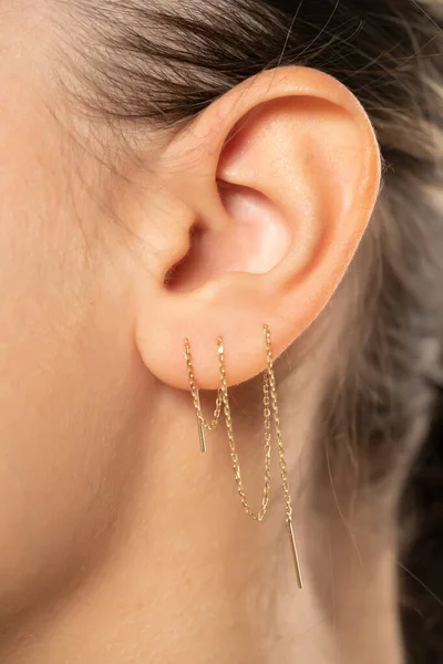 Female Ear Three Ear Chaines Close — Stock Photo, Image