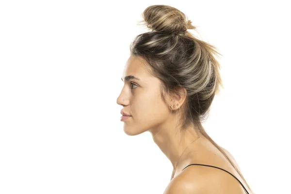 Young Woman Messy Loose Bun Makeup White Studio Background Side — Stock Photo, Image