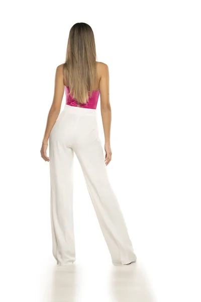 Rear View Young Modern Woman White Pants Pink Corset Posing — Stock Photo, Image