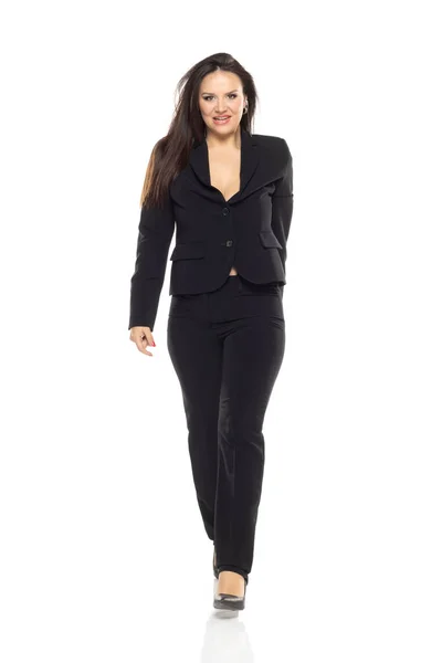 Full Length Joyful Businesswoman Fashionable Suit Pants Walking White Studio — Stock Photo, Image