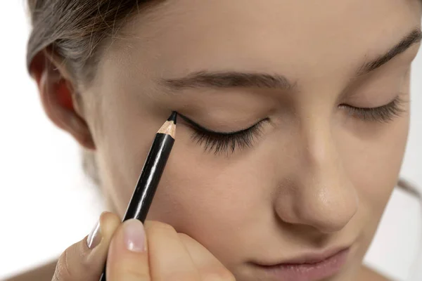 Woman Applying Eyeliner Eyelid Pencil White Studio Background — Stock Photo, Image