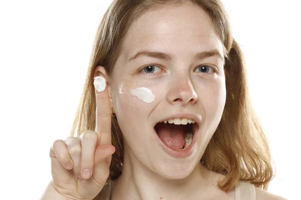 Happy Young Blonde Woman Showing Cream Her Finger White Studio — Stock Photo, Image