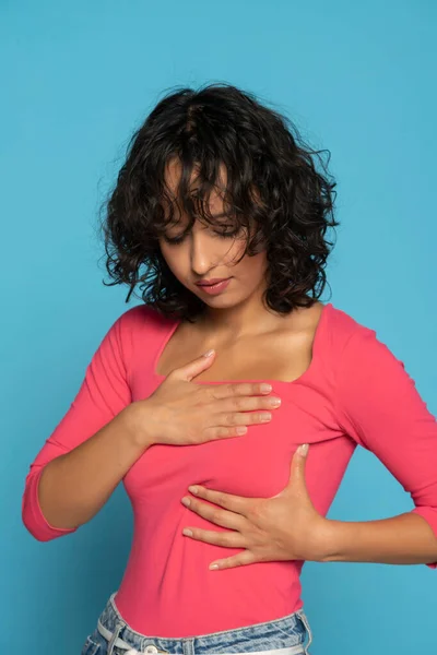Young Exotic Woman Examing Her Breast Blue Studio Background — Stock Photo, Image