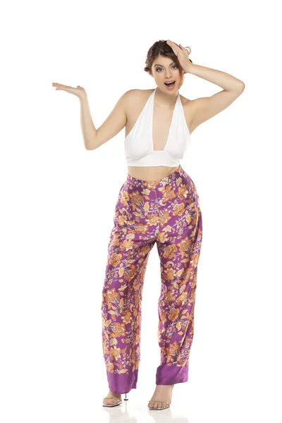 Smiling Excited Redhead Woman Floral Pants Sleevles Shirt Presenting Something — Stock Photo, Image