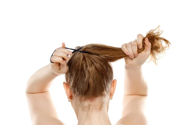Back Rear View Young Blond Woman Tying Her Long Hair — Stock Photo, Image
