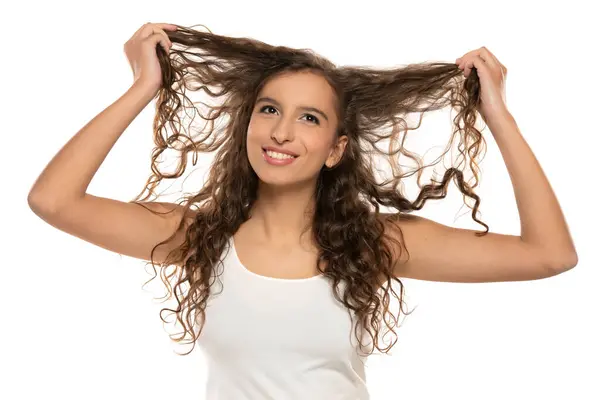 Portrait Young Smiling Woman Makeup Showing Her Long Wavy Hair Stock Image