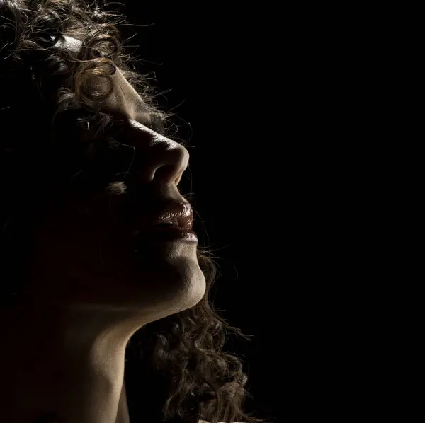 Sensual Profile Silhouette Portrait on Dark Studio Background