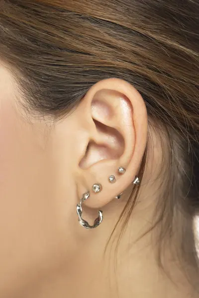 Closeup Female Ear Four Piercings — Stock Photo, Image