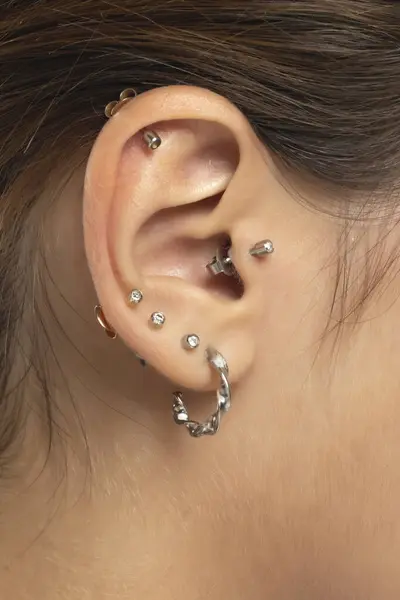 Closeup Female Ear Six Piercings — Stock Photo, Image