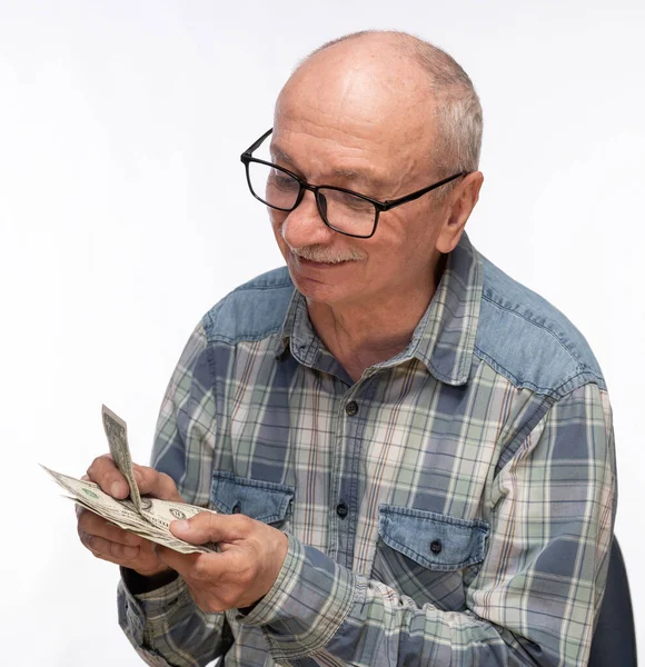 Senior Mann Hält Dollar Cadh Geld Über Weißem Hintergrund — Stockfoto