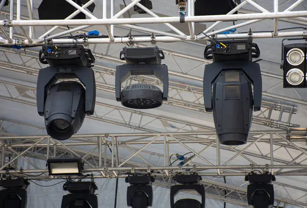 Stage lighting equipment on outdoor stage. Entertainment concert lighting