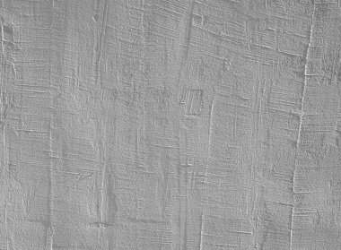 Yumuşak ve doğal ışıkla aydınlatılmış desenli beton duvarlar çeşitli desenler ve renkler sergiler. Yüzey, derinlik ve karakter ekleyen çatlaklar ve benzersiz tasarımlar içerir.