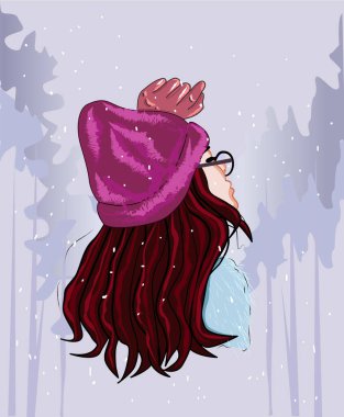 Kışın pembe şapkalı kız.