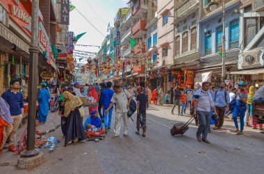 AJMER, INDIA - MARCH 3 2018: Colorful scene of beautiful people on the Dargah Bazar road of the old city center.