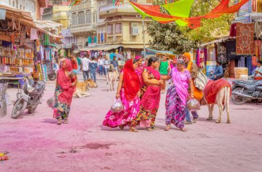 PUSHKAR, INDIA - MARCH 3 2018: Colorful scene of beautiful people on the street of the Holy City.
