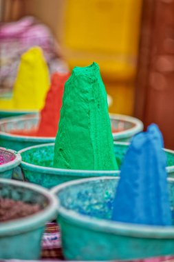 Displayed colorful powder kumkum for the Holy celebration on the street market of Pushkar India. close up
