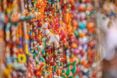 PUSHKAR, INDIA - MARCH 3 2018: Colorful scene of displayed souvenirs on the street market of the Holy City.