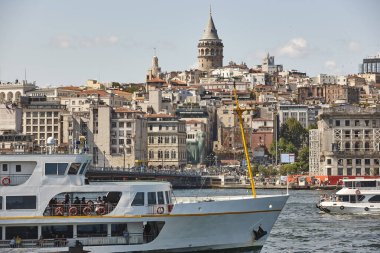 Ferry at Bosphorus strait in Istanbul. Galata tower. Turkey