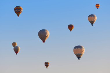 Spectacular balloons flying at sunrise in Goreme valley. Cappadocia, Turkey